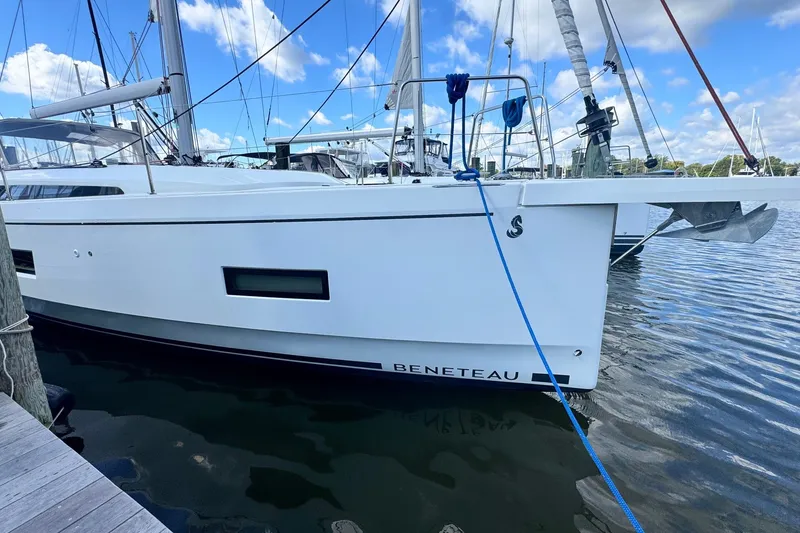 Slide: The Image of 2022 Beneteau Oceanis 40.1 yacht docked at marina under blue sky. - 48
