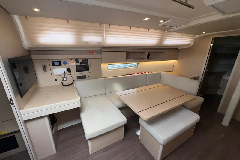 Slide: The Image of Interior of 2022 Beneteau Oceanis 40.1 yacht with modern seating and navigation area. - 33