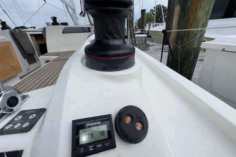 Slide: The Image of Close-up of 2022 Beneteau Oceanis 40.1 sailboat deck with winch and Yanmar display. - 13