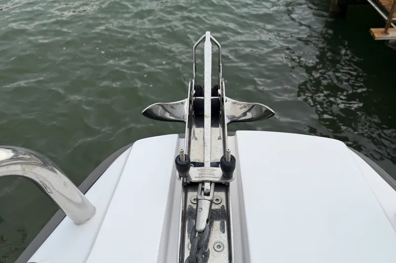 Slide: The Image of Bow view of 2023 Axopar 28 Cabin boat with anchor mechanism. - 37