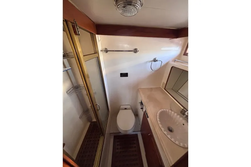 Slide: The Image of Bathroom interior of 1991 Kha Shing Motoryacht with shower, toilet, and sink. - 46