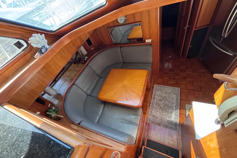 Slide: The Image of Interior of 1991 Kha Shing Motoryacht with wooden finishes and cozy seating area. - 21