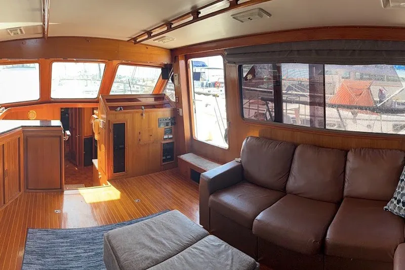 Slide: The Image of Interior of 1991 Kha Shing Motoryacht with wooden decor and leather seating. - 60