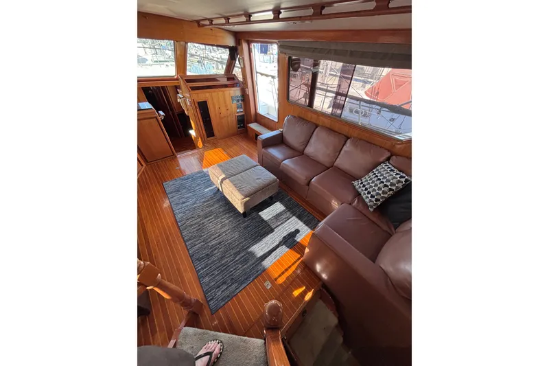 Slide: The Image of Luxurious 1991 Kha Shing Motoryacht interior with leather seating and elegant wood finishes. - 16