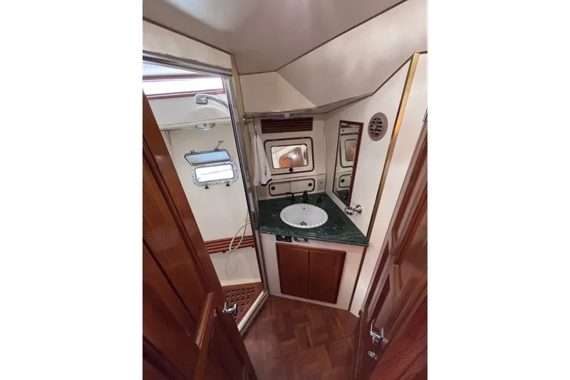 Slide: The Image of Luxurious 1991 Kha Shing Motoryacht bathroom with elegant wood and marble finishes. - 25