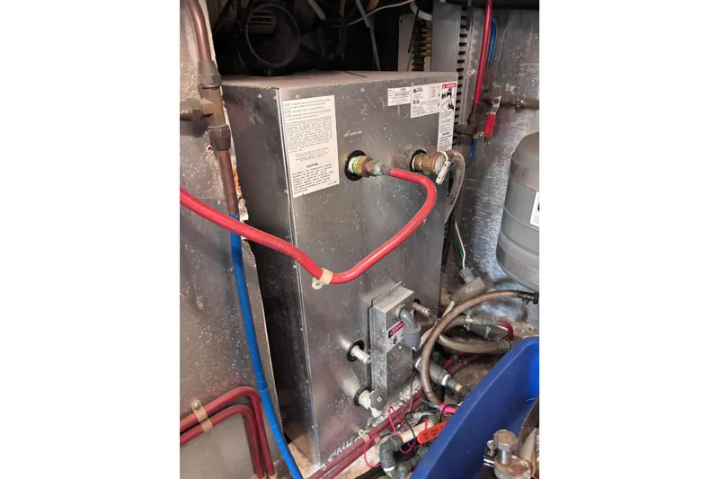 Slide: The Image of Engine room of 1991 Kha Shing Motoryacht with visible piping and equipment. - 40