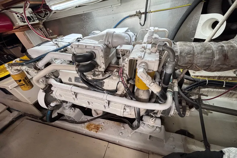Slide: The Image of Engine room of a 1991 Kha Shing Motoryacht, showcasing detailed mechanical components. - 33