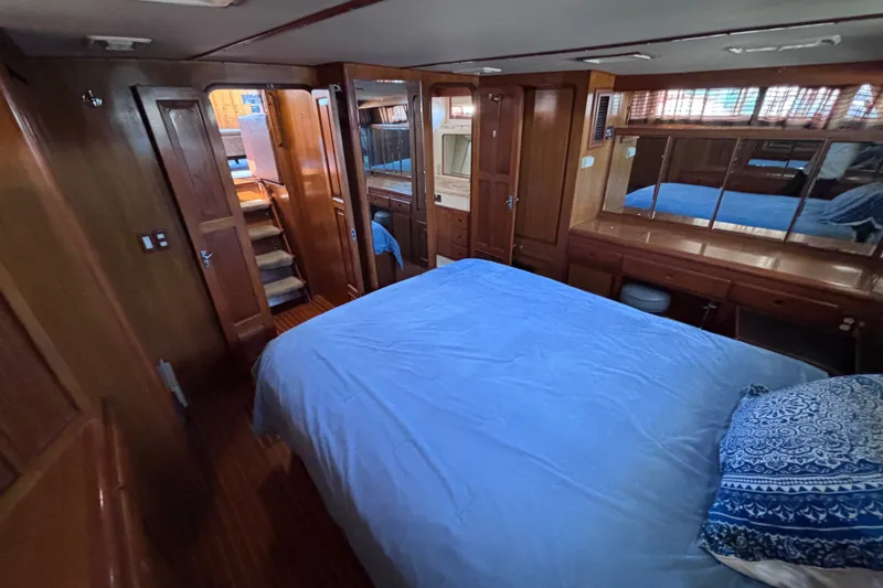 Slide: The Image of Luxurious 1991 Kha Shing Motoryacht bedroom with wooden interior and cozy bedding. - 50