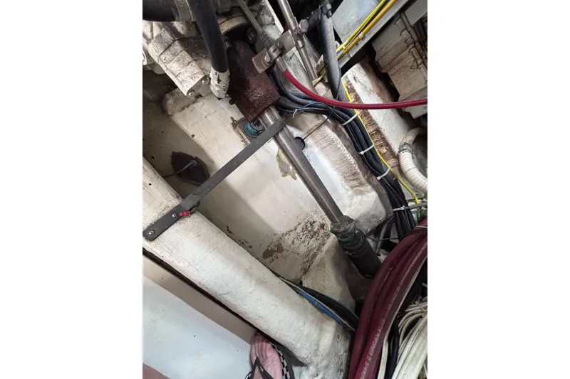 Slide: The Image of Engine room of a 1991 Kha Shing Motoryacht with visible cables and pipes. - 38