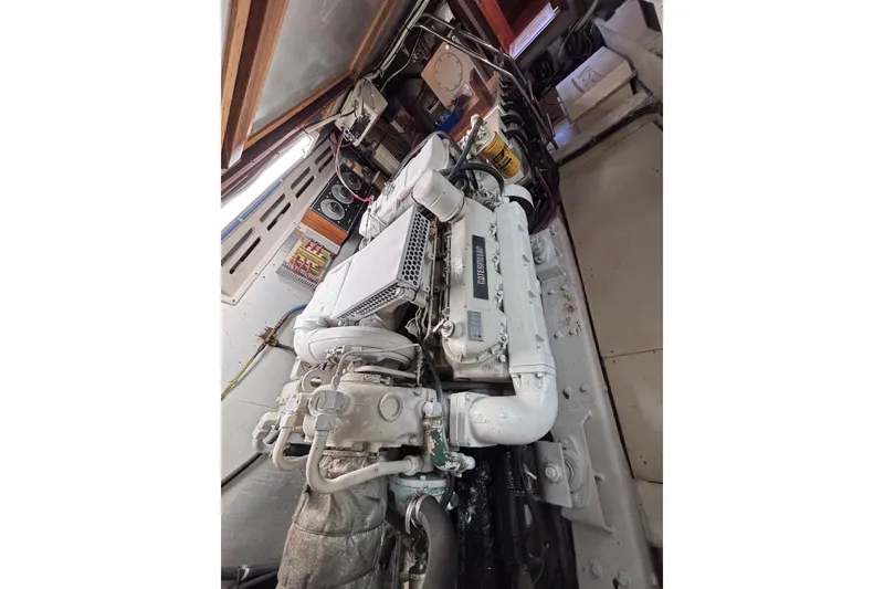 Slide: The Image of Engine room of a 1991 Kha Shing Motoryacht, featuring a Caterpillar engine. - 32