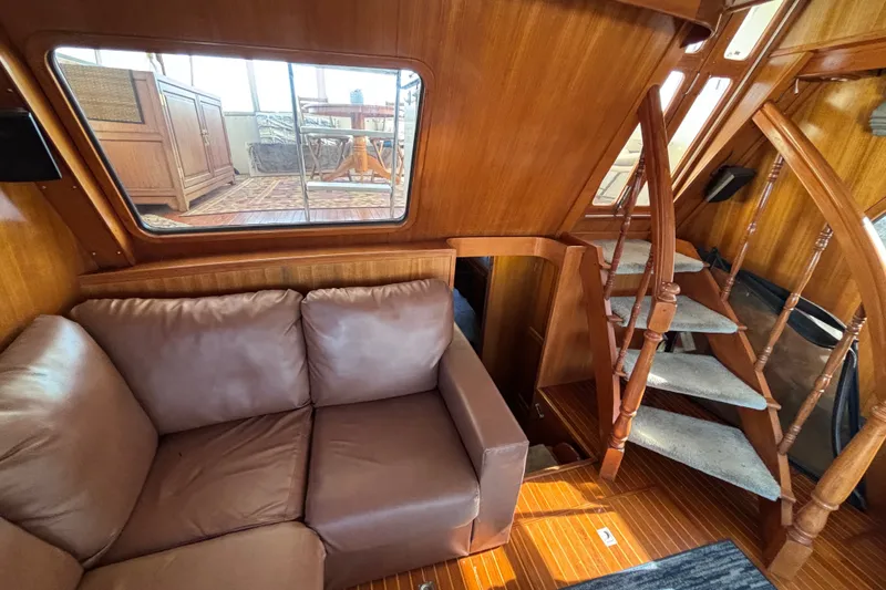 Slide: The Image of Interior of 1991 Kha Shing Motoryacht with wooden stairs and leather sofa. - 55