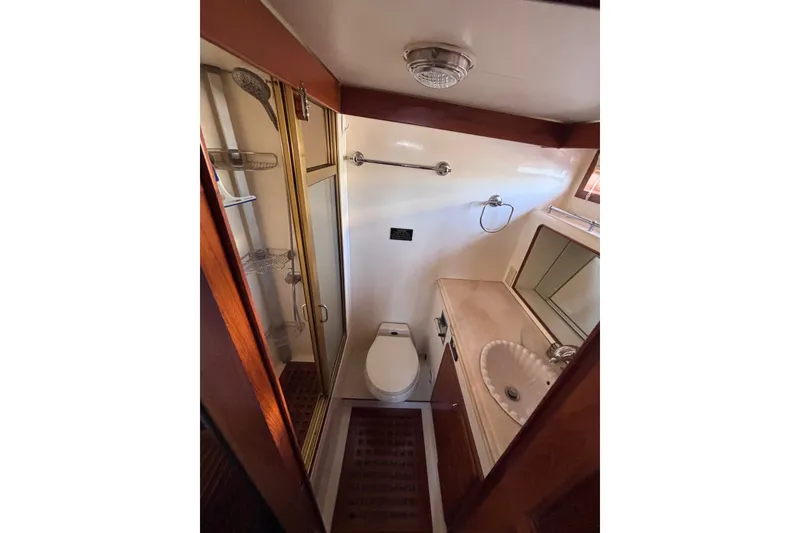 Slide: The Image of Bathroom interior of 1991 Kha Shing Motoryacht with shower, toilet, and sink. - 48
