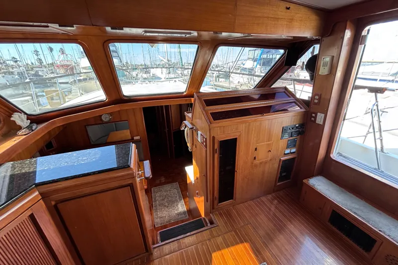 Slide: The Image of Interior of 1991 Kha Shing Motoryacht with wooden finishes and large windows. - 20