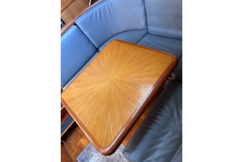 Slide: The Image of Luxurious wooden table and leather seating on a 1991 Kha Shing Motoryacht. - 31