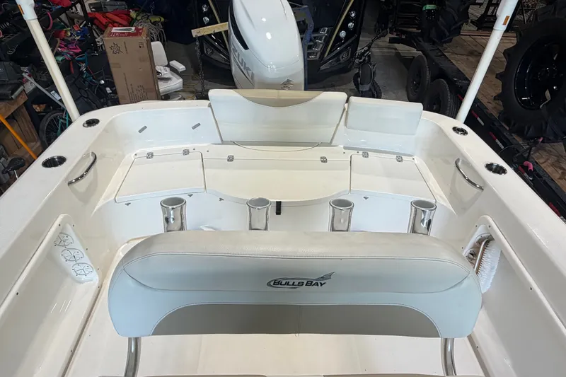 Slide: The Image of 2021 Bulls Bay 230 Center Console boat interior with seating and storage compartments. - 13