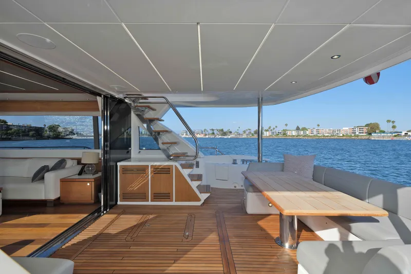 Slide: The Image of Luxurious 2018 Sunseeker 76 Yacht deck with elegant seating and scenic ocean view. - 32