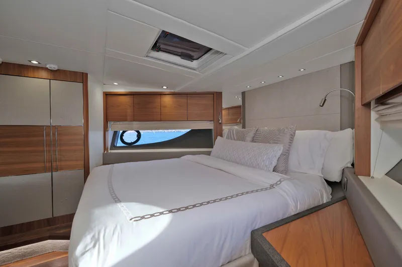 Slide: The Image of Luxurious bedroom interior of 2018 Sunseeker 76 Yacht with elegant wood finishes. - 59