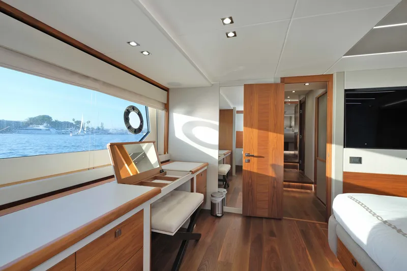 Slide: The Image of Luxurious interior of 2018 Sunseeker 76 Yacht with elegant wood finishes and scenic ocean view. - 64