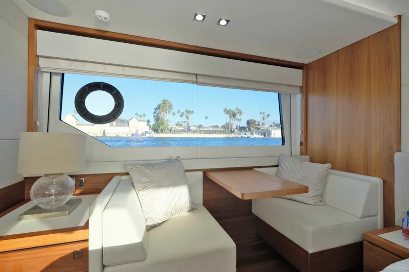 Slide: The Image of Luxurious interior of 2018 Sunseeker 76 Yacht with elegant seating and scenic window view. - 66