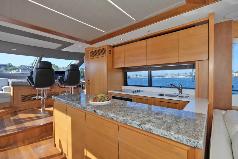 Slide: The Image of Luxurious interior of 2018 Sunseeker 76 Yacht with modern kitchen and ocean view. - 27
