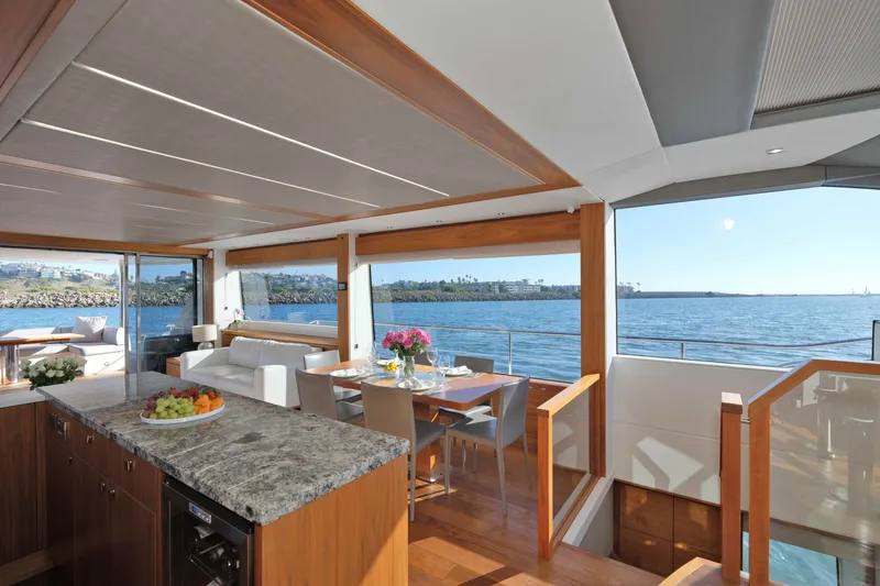 Slide: The Image of Luxurious interior of 2018 Sunseeker 76 Yacht with ocean view and elegant dining area. - 31