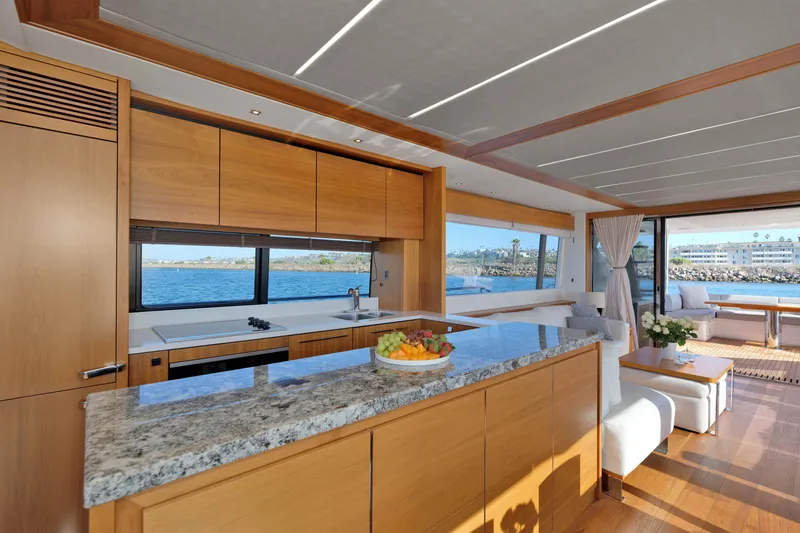Slide: The Image of Luxurious interior of 2018 Sunseeker 76 Yacht with modern kitchen and ocean view. - 12