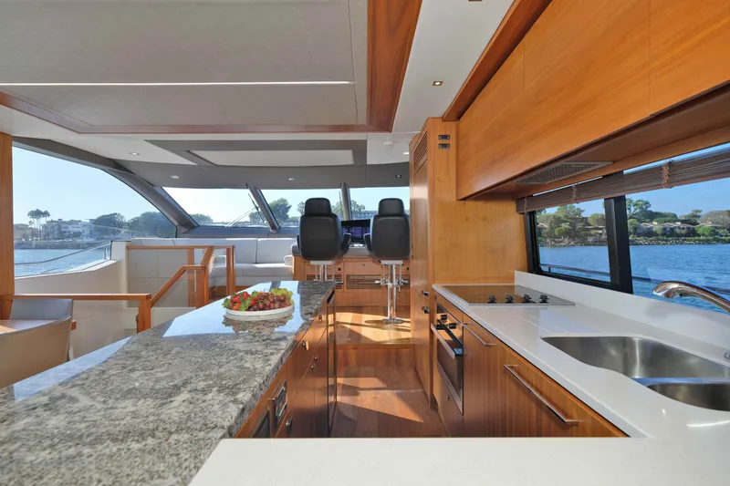 Slide: The Image of Luxurious interior of 2018 Sunseeker 76 Yacht with modern kitchen and scenic water views. - 28