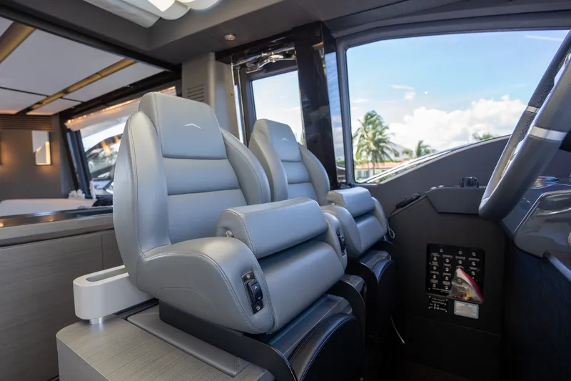 Slide: The Image of Luxurious interior of 2023 Azimut S8 yacht with modern seating and control panel. - 58