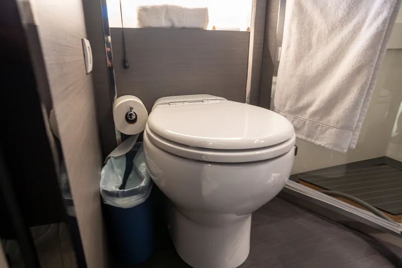 Slide: The Image of Luxury yacht Azimut S8 2023 bathroom with modern toilet and towel. - 28