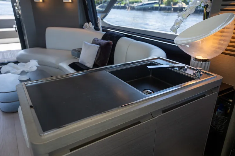 Slide: The Image of Luxurious interior of 2023 Azimut S8 yacht featuring sleek kitchenette and elegant seating area. - 60