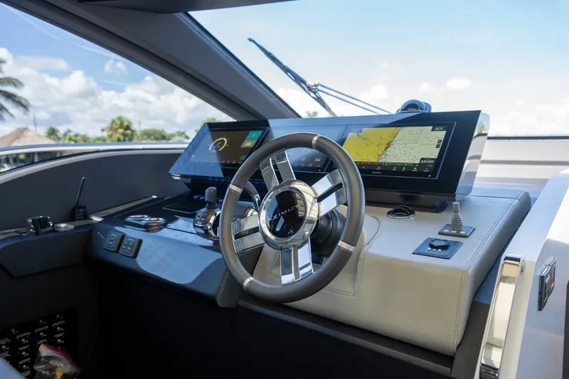 Slide: The Image of 2023 Azimut S8 yacht helm with modern navigation displays and sleek steering wheel. - 59