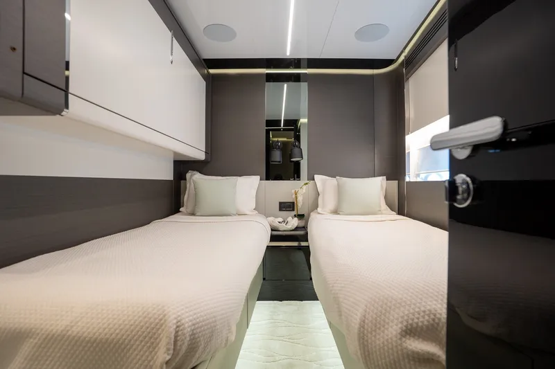 Slide: The Image of Luxurious 2023 Azimut S8 yacht cabin with twin beds and modern decor. - 22