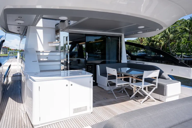 Slide: The Image of Luxurious 2023 Azimut S8 yacht deck with modern seating and dining area. - 48