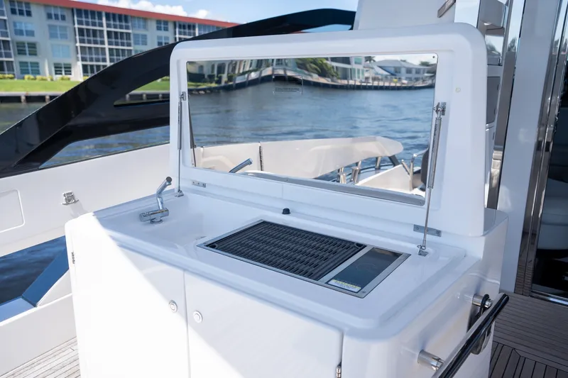 Slide: The Image of Outdoor kitchen on 2023 Azimut S8 yacht with grill and sink, overlooking water. - 50