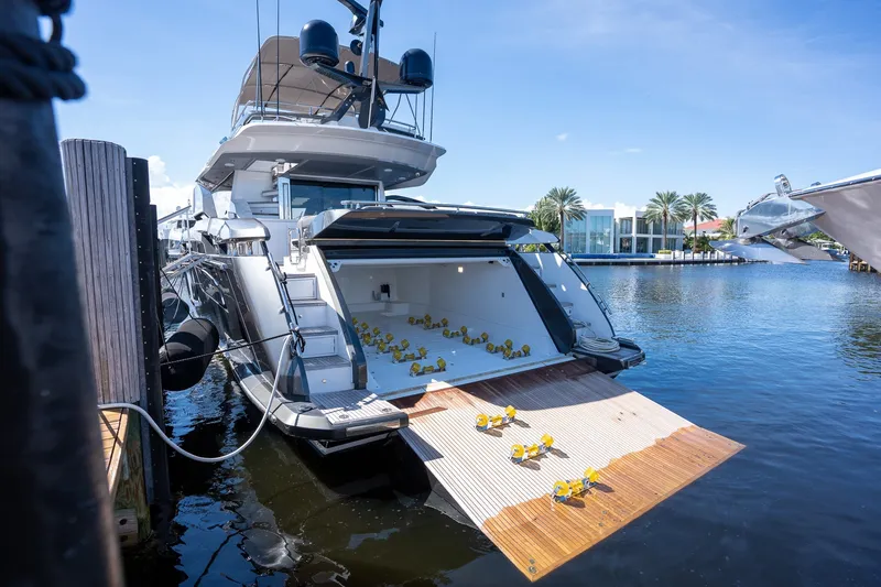 Slide: The Image of Luxury 2023 Azimut S8 yacht docked, featuring open deck with rubber ducks. - 68