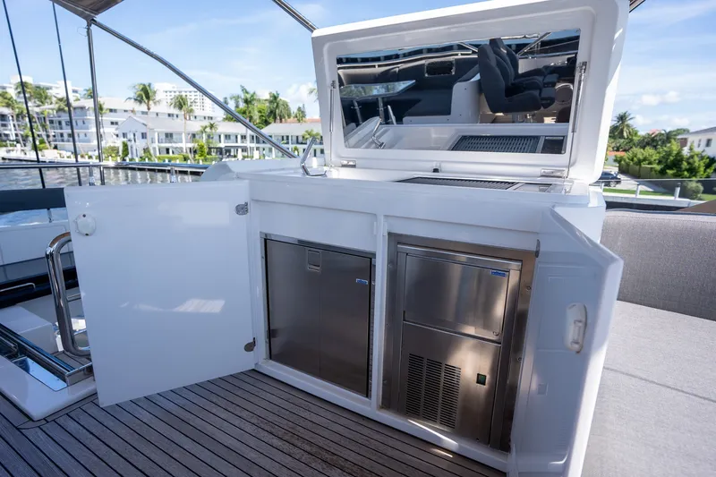 Slide: The Image of Outdoor kitchen on 2023 Azimut S8 yacht with stainless steel appliances and open cabinetry. - 66