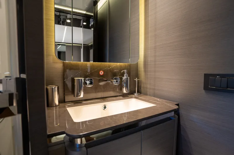Slide: The Image of Luxurious bathroom sink in 2023 Azimut S8 yacht, featuring modern fixtures and elegant design. - 27