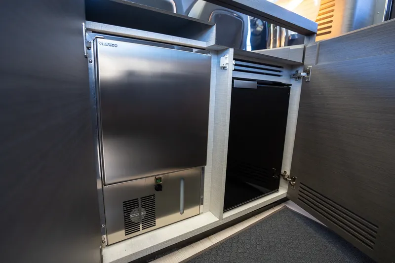 Slide: The Image of Compact refrigerator in the 2023 Azimut S8 yacht interior, showcasing modern design and functionality. - 62
