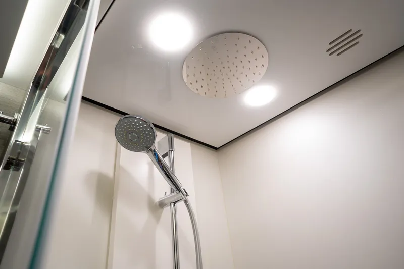 Slide: The Image of Luxurious shower in 2023 Azimut S8 yacht with modern fixtures and overhead lighting. - 20