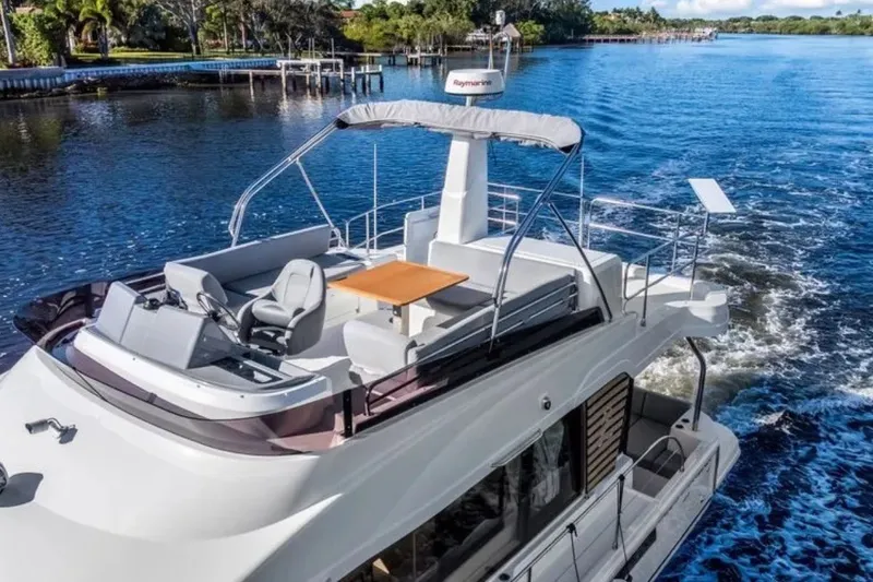 Slide: The Image of 2024 Beneteau Swift Trawler 41 Fly cruising on a scenic waterway. - 15