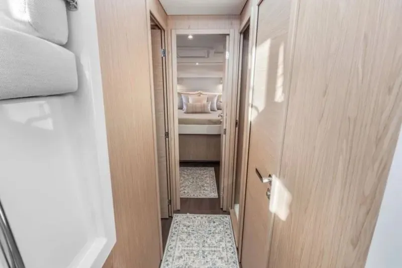 Slide: The Image of Interior hallway of 2024 Beneteau Swift Trawler 41 Fly, featuring modern wood finishes. - 32