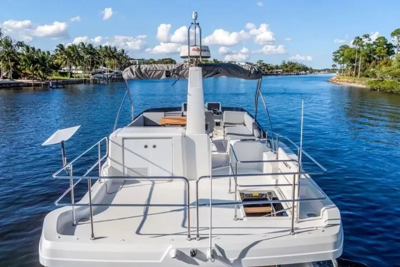 Slide: The Image of 2024 Beneteau Swift Trawler 41 Fly cruising on a scenic waterway. - 16