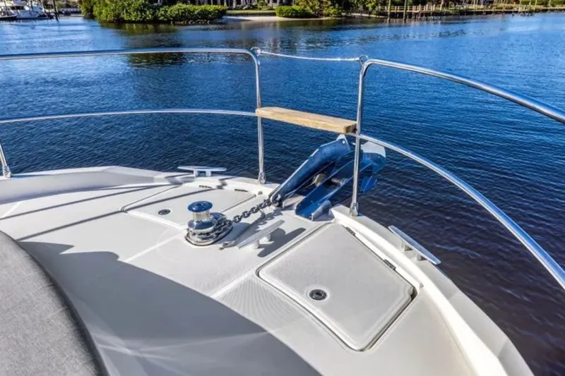Slide: The Image of Bow view of 2024 Beneteau Swift Trawler 41 Fly on calm water. - 14