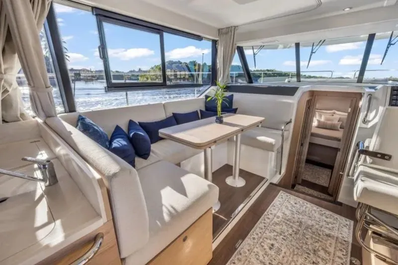 Slide: The Image of Luxurious interior of 2024 Beneteau Swift Trawler 41 Fly with elegant seating and scenic views. - 28