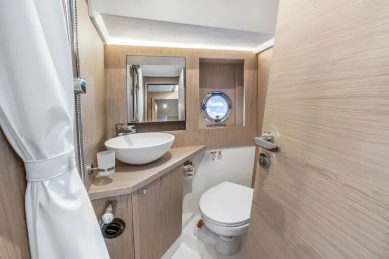 Slide: The Image of Luxurious bathroom in 2024 Beneteau Swift Trawler 41 Fly yacht, featuring modern fixtures and elegant design. - 45