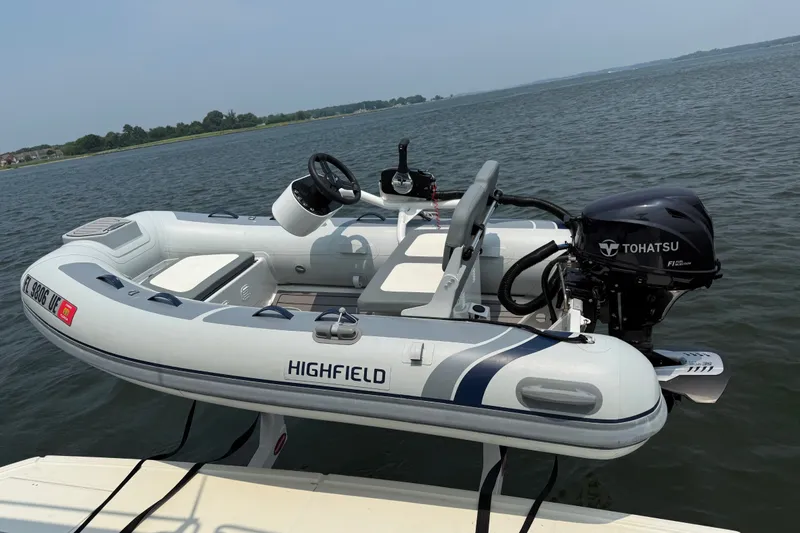 Slide: The Image of Highfield inflatable boat with Tohatsu engine on Beneteau Swift Trawler 41 Fly, 2024 model. - 11