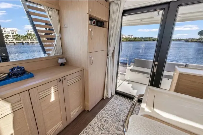 Slide: The Image of Interior of 2024 Beneteau Swift Trawler 41 Fly with scenic water view. - 26