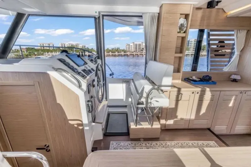 Slide: The Image of Interior of 2024 Beneteau Swift Trawler 41 Fly, featuring helm and seating area. - 29