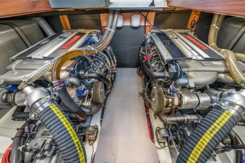 Slide: The Image of Engine room of 2024 Beneteau Swift Trawler 41 Fly, featuring dual Yanmar engines. - 47