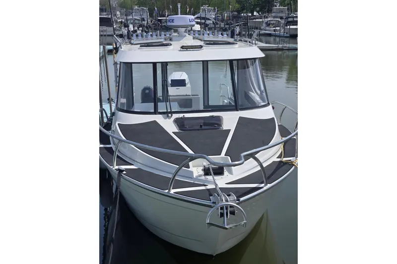 The Image of 2026 Extreme Boats 915 Game King, docked, showcasing sleek design and advanced features. - 2